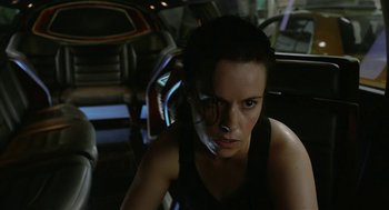 Movie still from “Cosmopolis” (2012), directed by David Cronenberg – A woman sitting in the back seat of a car; Close Up shot, Over the shoulder angle