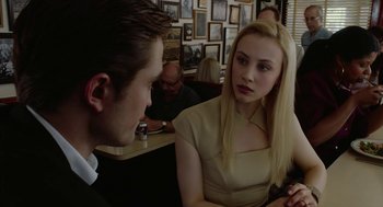 Movie still from “Cosmopolis” (2012), directed by David Cronenberg – A man and a woman sitting at a table talking to each other; Close Up shot, Over the shoulder angle