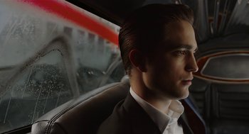 Movie still from “Cosmopolis” (2012), directed by David Cronenberg – A man sitting in a car looking out the window; Close Up shot, Low angle
