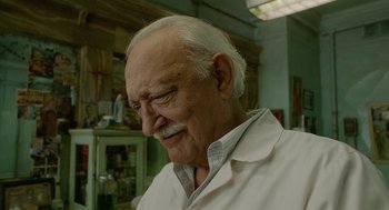 Movie still from “Cosmopolis” (2012), directed by David Cronenberg – An old man with a beard and a mustache; Close Up shot, Low angle