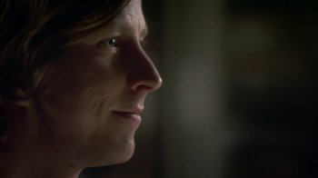 Movie still from “Crooked House” (2017), directed by Gilles Paquet-Brenner – A woman's face in the dark; Extreme Close Up shot, Over the shoulder angle