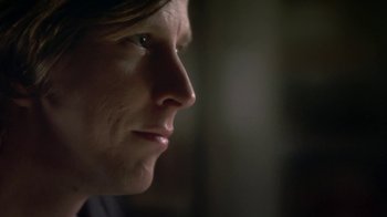 Movie still from “Crooked House” (2017), directed by Gilles Paquet-Brenner – A woman's face in the dark; Close Up shot, Over the shoulder angle