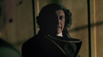 Movie still from “Crooked House” (2017), directed by Gilles Paquet-Brenner – A man in a black coat and a white beard; Close Up shot, Over the shoulder angle