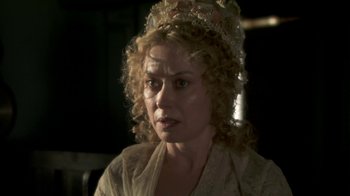 Movie still from “Crooked House” (2017), directed by Gilles Paquet-Brenner – A person wearing a dress; Close Up shot, High angle