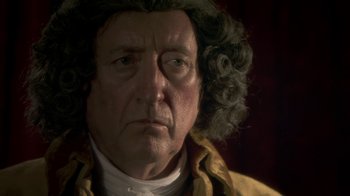 Movie still from “Crooked House” (2017), directed by Gilles Paquet-Brenner – A wax figure of a man; Close Up shot, Over the shoulder angle