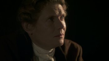 Movie still from “Crooked House” (2017), directed by Gilles Paquet-Brenner – An older woman looking up into the dark; Close Up shot, Over the shoulder angle