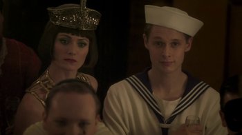 Movie still from “Crooked House” (2017), directed by Gilles Paquet-Brenner – A man and a woman dressed in sailor outfits; Close Up shot, Over the shoulder angle
