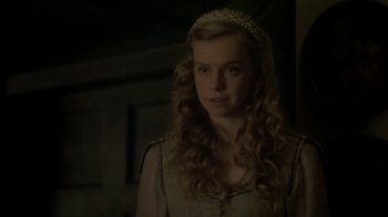 Movie still from “Crooked House” (2017), directed by Gilles Paquet-Brenner – A woman with long blonde curly hair wearing a tiara; Close Up shot, Over the shoulder angle