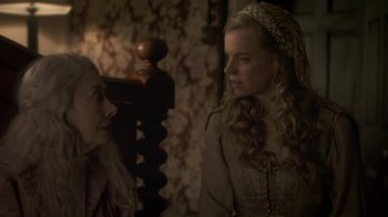 Movie still from “Crooked House” (2017), directed by Gilles Paquet-Brenner – Two people in a room talking to each other; Close Up shot, Over the shoulder angle