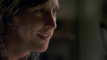 Movie still from “Crooked House” (2017), directed by Gilles Paquet-Brenner – A woman's face in a dark room; Close Up shot, Over the shoulder angle