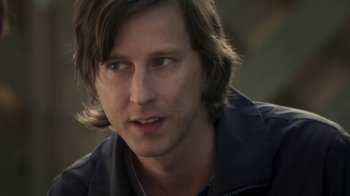 Movie still from “Crooked House” (2017), directed by Gilles Paquet-Brenner – A person with long hair; Close Up shot, Over the shoulder angle