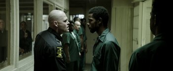 A group of men standing next to each other in a room