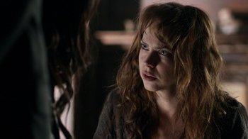 Movie still from “Curse of Chucky” (2013), directed by Don Mancini – A person with long hair; Close Up shot, Over the shoulder angle