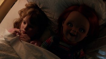 Movie still from “Curse of Chucky” (2013), directed by Don Mancini – Two children laying in a bed next to each other; Close Up shot, Overhead angle