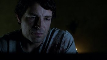 Movie still from “Curse of Chucky” (2013), directed by Don Mancini – A person looking at a computer screen; Close Up shot, Over the shoulder angle