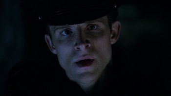 Movie still from “Curse of Chucky” (2013), directed by Don Mancini – A person wearing a hat; Close Up shot, Low angle