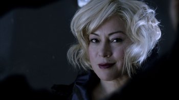 Movie still from “Curse of Chucky” (2013), directed by Don Mancini – A person with blonde hair; Close Up shot, Over the shoulder angle