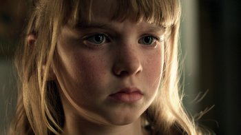 Movie still from “Curse of Chucky” (2013), directed by Don Mancini – A young girl's face with blue eyes; Close Up shot, High angle