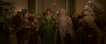 Movie still from “Cyrano” (2021), directed by Joe Wright – A group of people dressed in period costumes; Wide shot, Low angle