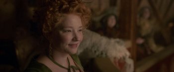 Movie still from “Cyrano” (2021), directed by Joe Wright – A person with curly red hair; Close Up shot, Over the shoulder angle