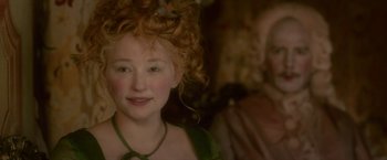 Movie still from “Cyrano” (2021), directed by Joe Wright – A person with curly red hair; Close Up shot, Over the shoulder angle