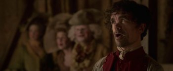 Movie still from “Cyrano” (2021), directed by Joe Wright – A man and a woman dressed in period clothing; Close Up shot, Over the shoulder angle