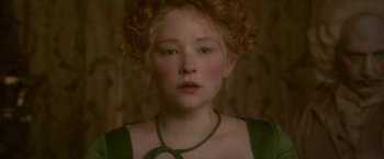 Movie still from “Cyrano” (2021), directed by Joe Wright – A person with curly red hair; Close Up shot, Over the shoulder angle