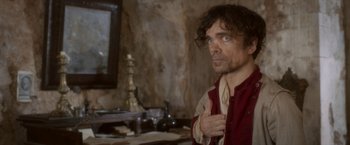 Movie still from “Cyrano” (2021), directed by Joe Wright – A person with a mirror in a room; Medium shot, Over the shoulder angle