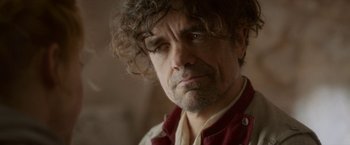 Movie still from “Cyrano” (2021), directed by Joe Wright – A person wearing a jacket; Close Up shot, Low angle