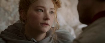 Movie still from “Cyrano” (2021), directed by Joe Wright – A person with curly blonde hair; Close Up shot, Over the shoulder angle