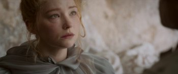 Movie still from “Cyrano” (2021), directed by Joe Wright – A person wearing a dress; Close Up shot, Over the shoulder angle