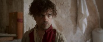 Movie still from “Cyrano” (2021), directed by Joe Wright – A person wearing a shirt and tie; Close Up shot, Low angle