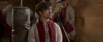 Movie still from “Cyrano” (2021), directed by Joe Wright – A person wearing a costume; Medium shot, Over the shoulder angle