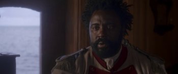 Movie still from “Cyrano” (2021), directed by Joe Wright – A person wearing a uniform; Close Up shot, Over the shoulder angle