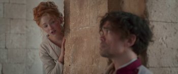 Movie still from “Cyrano” (2021), directed by Joe Wright – A man and a woman looking at each other; Medium shot, Over the shoulder angle