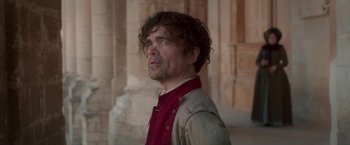 Movie still from “Cyrano” (2021), directed by Joe Wright – A person wearing a jacket; Medium shot, Low angle