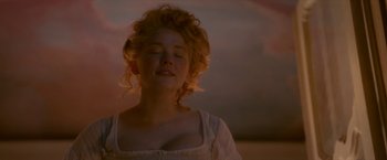 Movie still from “Cyrano” (2021), directed by Joe Wright – A woman with her eyes closed with her eyes closed; Close Up shot, Low angle