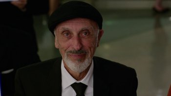 Movie still from “Daddy's Home” (2015), directed by Sean Anders – An older man wearing a black hat and a white beard; Close Up shot, Over the shoulder angle