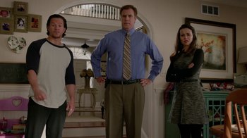 Movie still from “Daddy's Home” (2015), directed by Sean Anders – Two men and a woman standing in front of a doorway; Medium shot, Over the shoulder angle