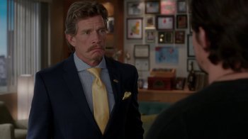 Movie still from “Daddy's Home” (2015), directed by Sean Anders – A man wearing a suit and tie standing in a room; Close Up shot, Over the shoulder angle