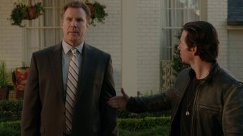 Movie still from “Daddy's Home” (2015), directed by Sean Anders – Two men in business suits standing next to each other; Medium shot, Over the shoulder angle
