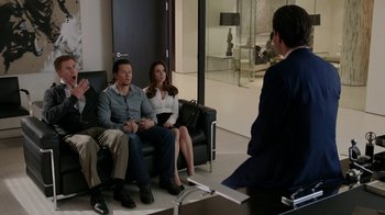 Movie still from “Daddy's Home” (2015), directed by Sean Anders – A group of people sitting on a couch in a room; Wide shot, Over the shoulder angle