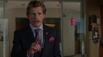 Movie still from “Daddy's Home” (2015), directed by Sean Anders – A man in a suit and tie talking to the camera; Close Up shot, Over the shoulder angle