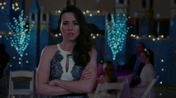 Movie still from “Daddy's Home” (2015), directed by Sean Anders – A woman standing in front of a bunch of lights in a room; Close Up shot, Over the shoulder angle