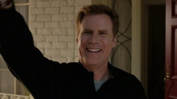 Movie still from “Daddy's Home” (2015), directed by Sean Anders – A man with a goatee smiling for the camera; Medium shot, Low angle