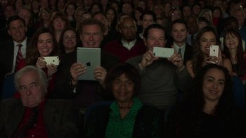 Movie still from “Daddy's Home 2” (2017), directed by Sean Anders – A group of people taking pictures with their ipads; Medium shot, Overhead angle