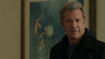 Movie still from “Daddy's Home 2” (2017), directed by Sean Anders – An older man standing in front of a painting; Close Up shot, Over the shoulder angle