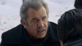 Movie still from “Daddy's Home 2” (2017), directed by Sean Anders – An older man with grey hair and blue eyes; Close Up shot, Over the shoulder angle