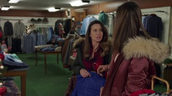 Movie still from “Daddy's Home 2” (2017), directed by Sean Anders – Two women are talking to each other in a clothing store; Medium shot, Over the shoulder angle