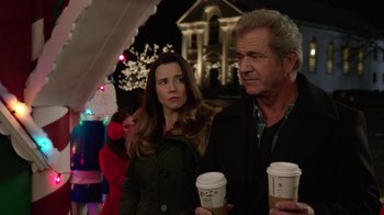 Movie still from “Daddy's Home 2” (2017), directed by Sean Anders – A man and a woman standing next to each other holding coffee cups; Close Up shot, Over the shoulder angle